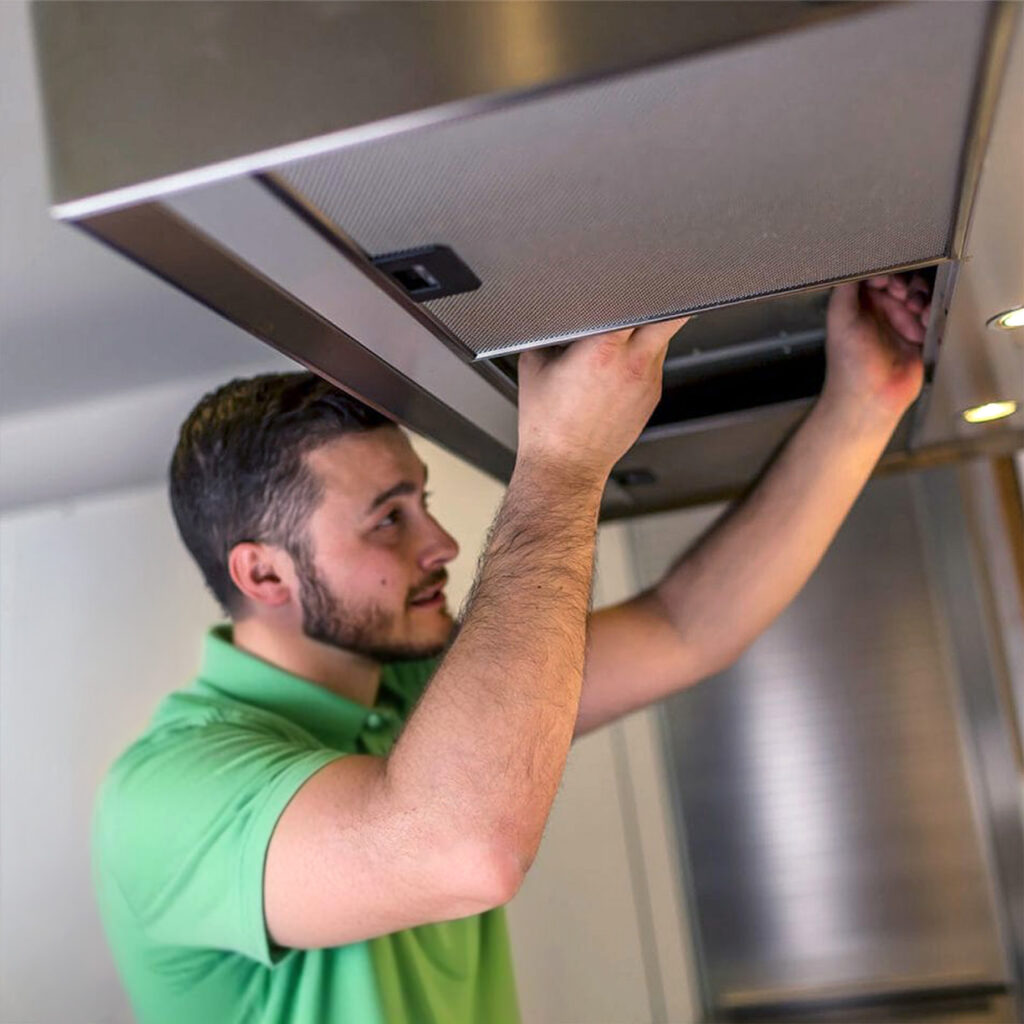 Worleys technician installing kitchen hood