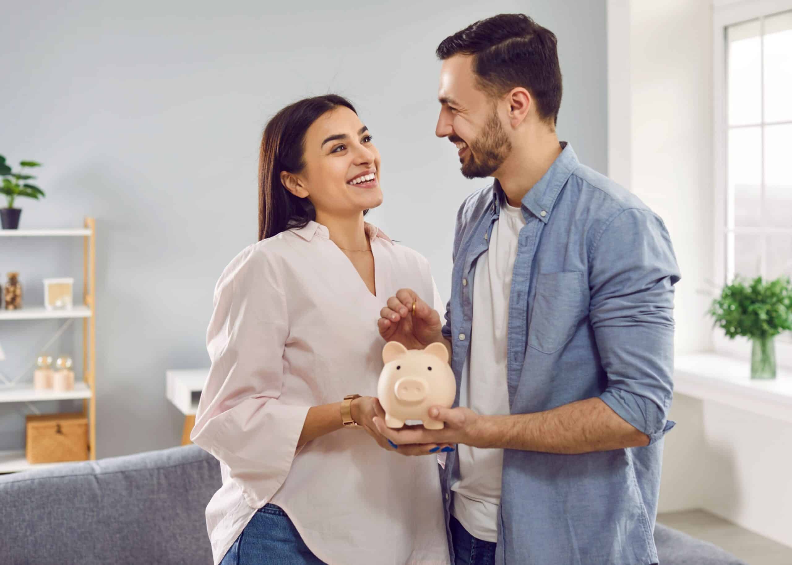 Couple smiling and happy about their savings from a rebate program.