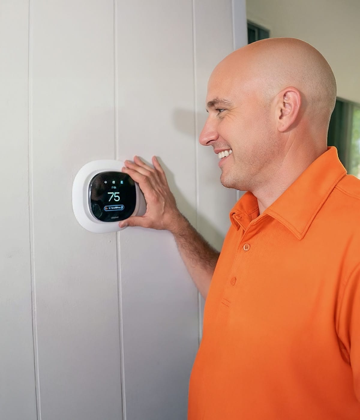 HVAC tech installing smart thermostat