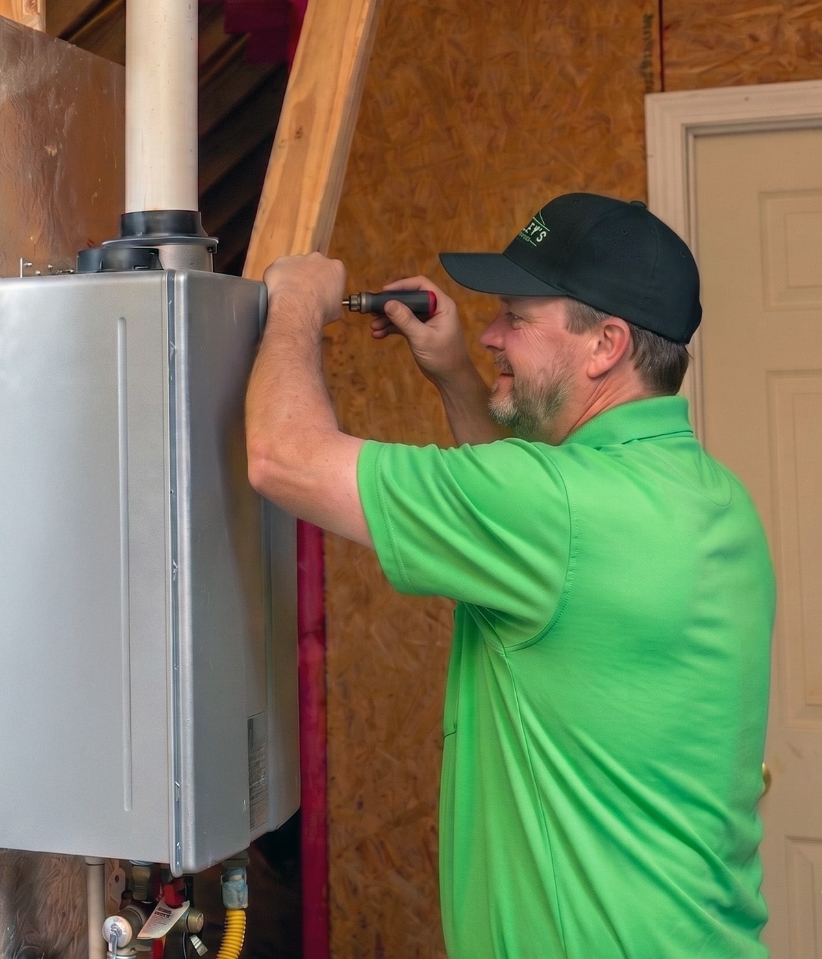 Technician installing a Rinnai tankless water heater