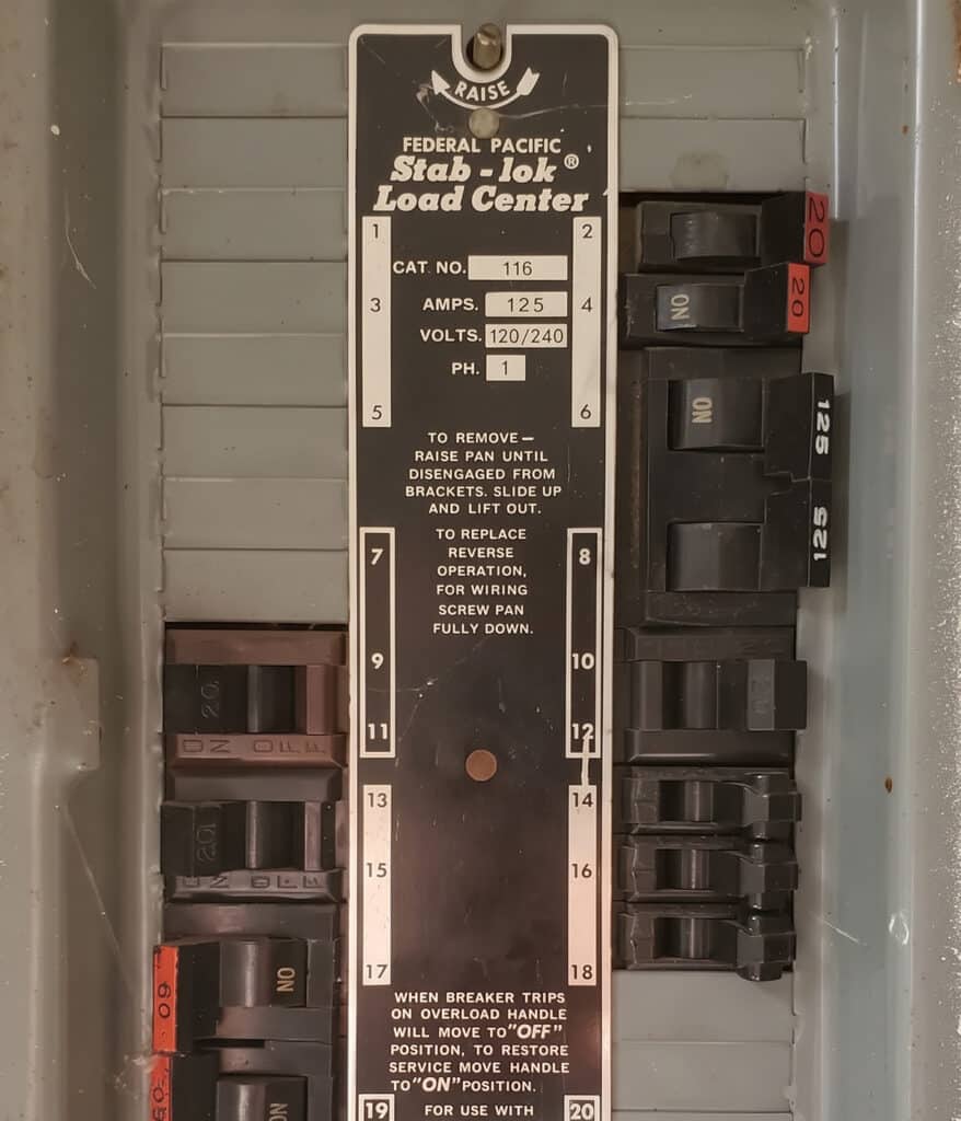 Close-up of a 125-amp Federal Pacific Stab-Lok label between rows of breakers, documented by Worley's in York Town.