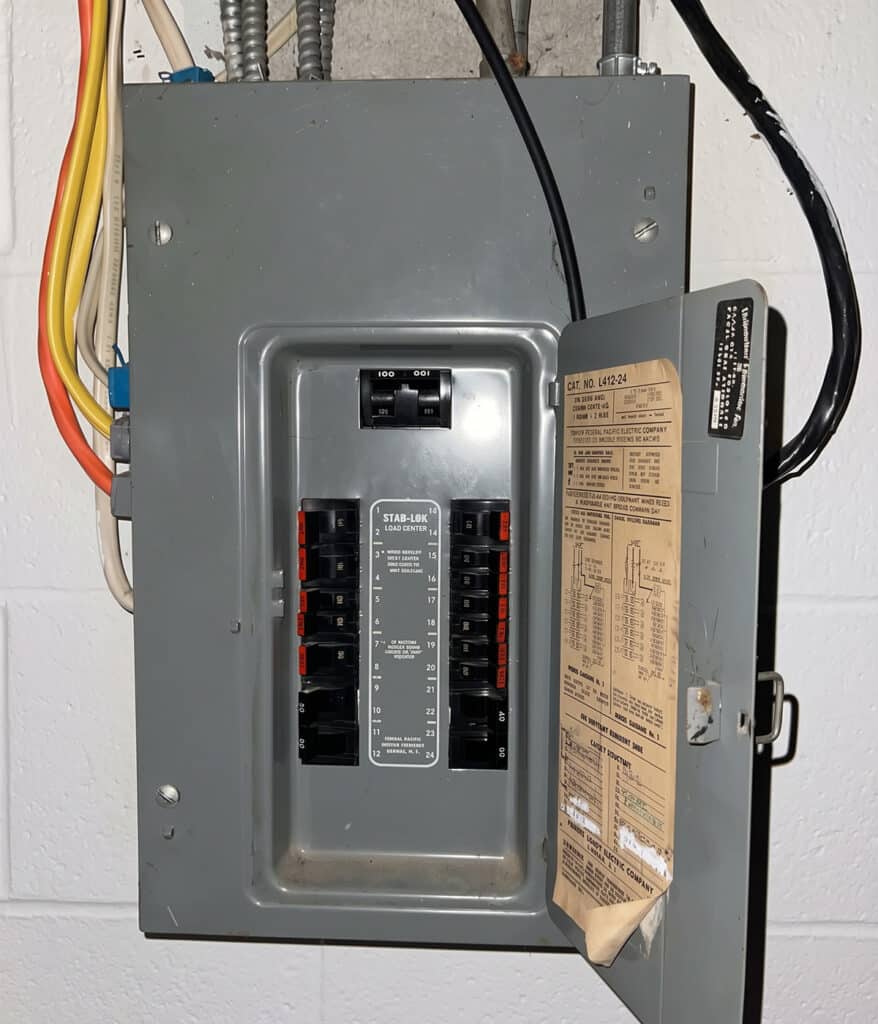 Aging Federal Pacific Stab-Lok breaker panel with its door open, found by Worley's Home Services in a York Town home.